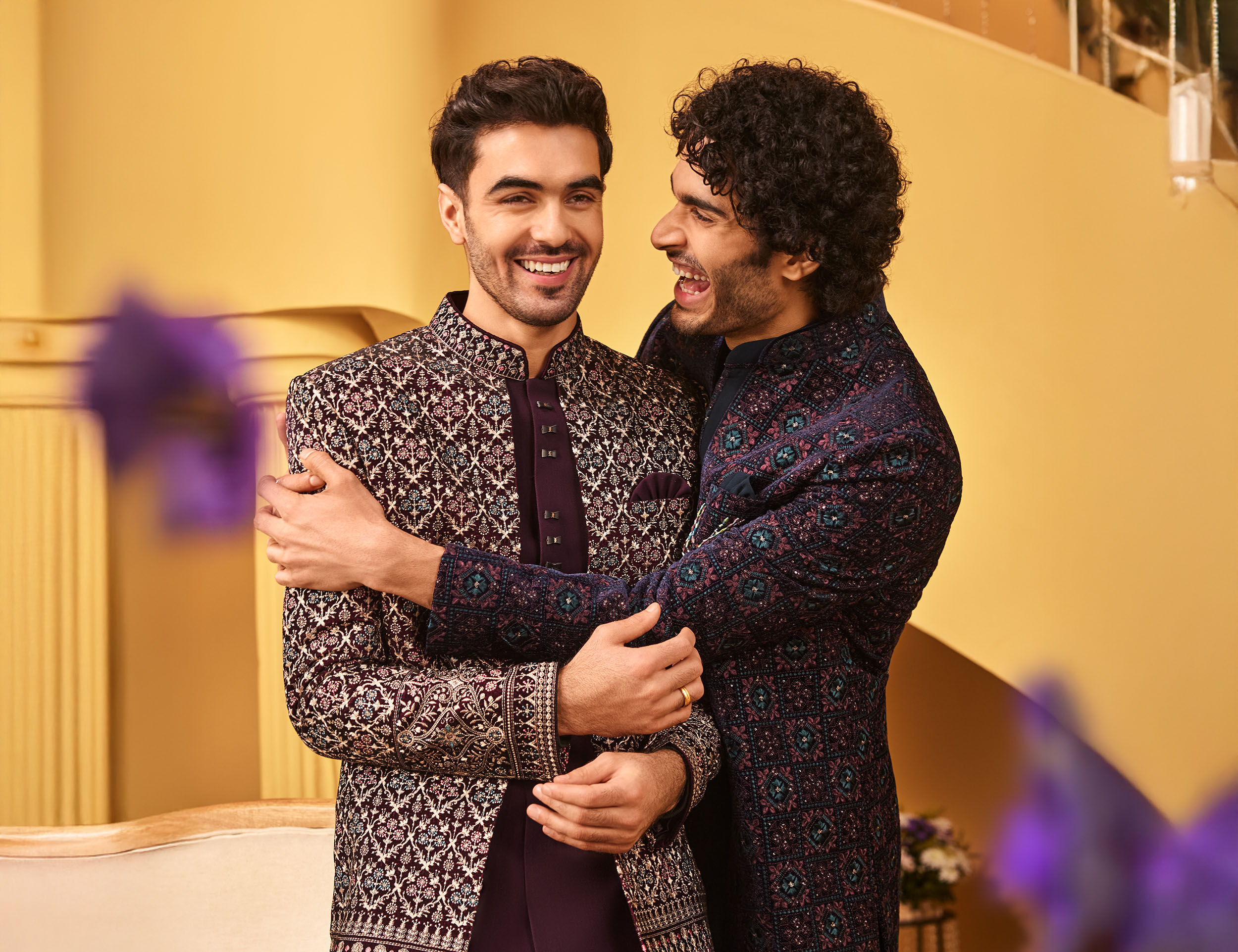 Groom and his friend dressed in elegant Indo-Western kurtas, blending tradition and modern style for the wedding